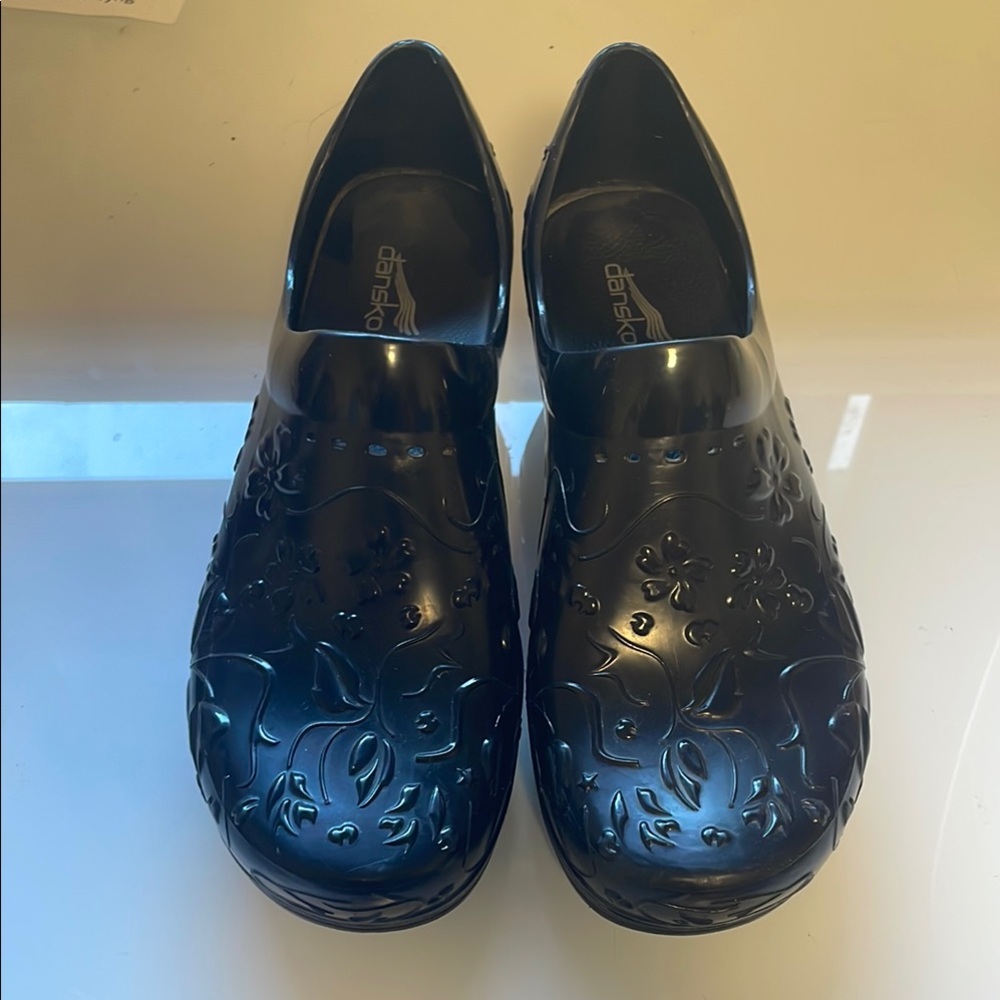 Dansko pixie Waterproof Black vegan Comfort Clogs with Embossed floral Design